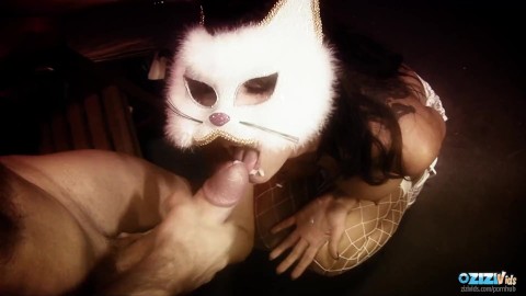 Dressing up as a sexy kitty the horny brunette goes down on a large cock