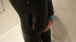 Wetsuit girl showering in tight zone 3 wetsuit