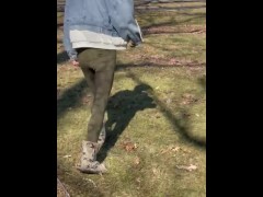 Chinese milf walk in park peeing in pants.