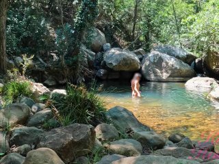 VOYEURON A GIRL BATHING IN_A SUNNY STREAM