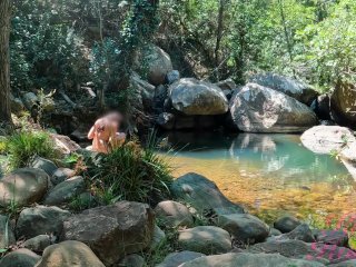 VOYEUR ON A GIRL BATHING IN A SUNNY STREAM