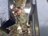 Horny Colombian soldier jerks off on a military boat in public