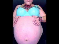 Rubbing Oiled Massive Pregnant Belly