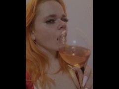 red-haired sexy girl drink vine and dream aboyte you