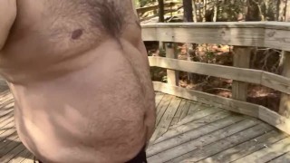 Chubby bear shows off in the woods