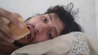 Guy stuff himself w hot dogs laid in hia BED, Relaxing
