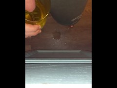Trans guy peeing into cups with stp