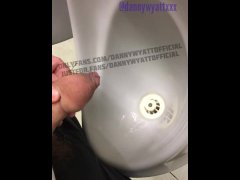 Piss at the urinal being watched