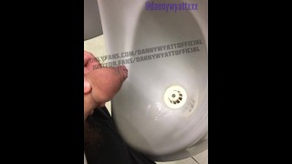 Piss at the urinal being watched