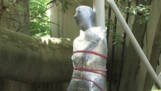 Full Encasement Fetish In Zentai Body Bag Bondaged And Cocooned Slave Girl In The Mystery Garden