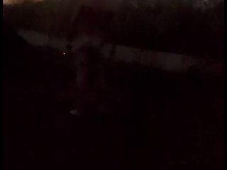 Standing naked at side of road trying to hide from cars