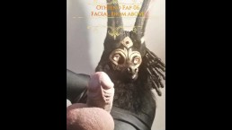 Anubis towers above you stroking his huge cock until he unloads into your hungry mouth