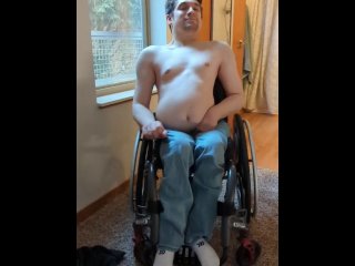 Paraplegic strips in his wheelchair