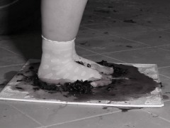 Mature BBW milf crushes grapes with her feet in nylon socks.