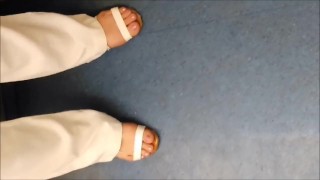 Glamorous pedicure - feet in the subway