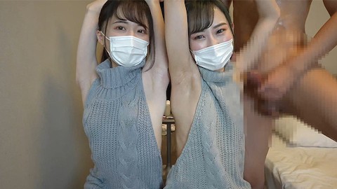 日本の女の子は男にセクシーな腕の前で脇の下と手コキを与えます。