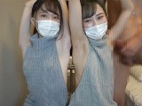 Japanese girls gives a guy an armpitjob and handjob wearing a sexysweater.