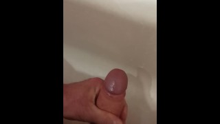 Jerking off dick and cumming in the bathroom.