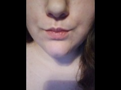 Sensually eating a red orange