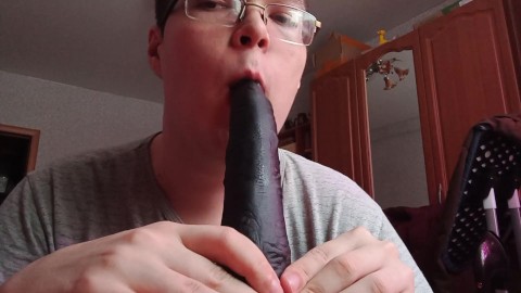 Practicing blowjob skill on dildos