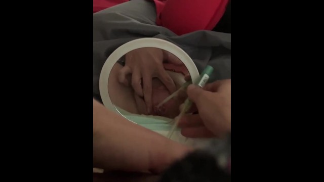 Paraplegic girl intermittent cathing while in bed