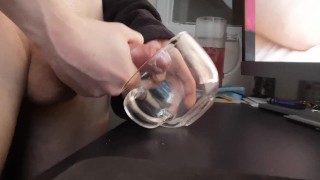 Jerking off a load into a glass mug
