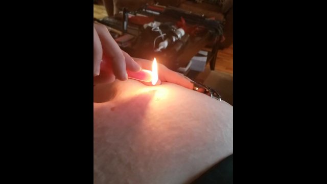 Domme uses fire play on sub