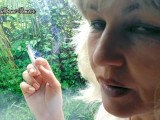 Hot milf smoking and playing with herself outdoor in garden.