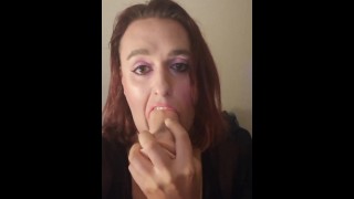 Transgirl chokes down on thick dildo