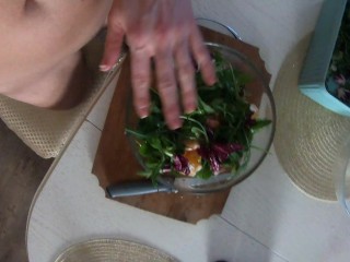 Naked Girl cooks salad