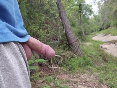 taking a piss deep in the woods with flexing at the end