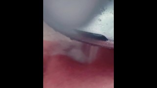 Horny slut in a shower making herself cum hard