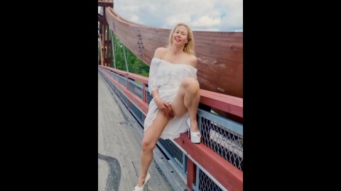 Hot MILF in public fingering an orgasm on the bridge over the busy highway