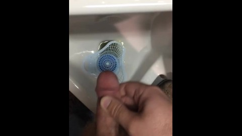 horny hairy trucker masturbates into truck stop urinal