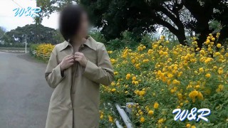 Personal Photo Shoot With Breasts Visible Next To Flowers On The Road