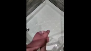 Masturbating cumshot in the shower