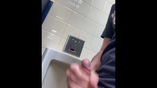 Jerking at a crowded urinal