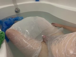 Plastic Bag Man taking a fun bath