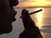 Preview 2 of Smoking 2 Cigarettes on the Beach... at day and in Sunset