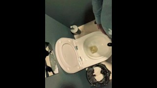 Man unzips his pants pissing in office toilet and shows his wet cock close to camera