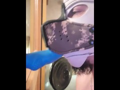 Pup suck on didlo with chastity on