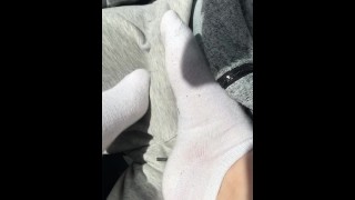 Femdom footjob a white socks in car