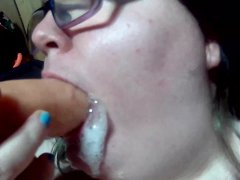 sucking a dildo and swallowing cum