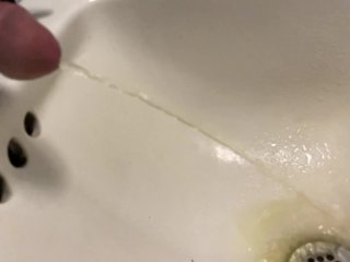 Slow mo pissing in the sink