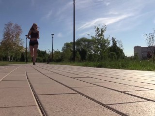 SFW. a Girl in a Sexy Suit is Engaged in Fitness. Running and Squats