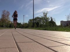 SFW. A girl in a sexy suit is engaged in fitness. Running and squats