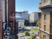 Preview 4 of A woman undresses on a balcony in the city center. Public flashing.