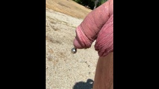 Pierced Pissing outdoors