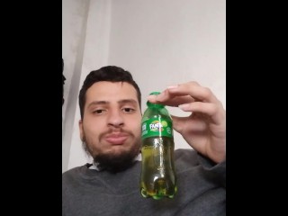 Man Drinking a Bit of Soda to Burp