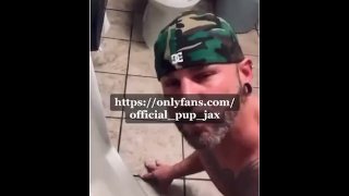 drinking and spitting piss from public restroom urinal naked.